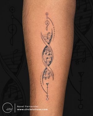 Music Note and Dna Tattoo made by Novel Fernandez at Circle Tattoo India