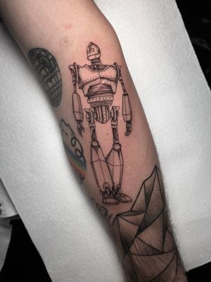 Unique dotwork tattoo of Iron Giant inspired by comics, expertly executed by Claudia Whiteheart in fine line illustrative style.