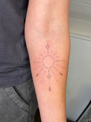 Sun and star motifs delicately intertwined in a stunning ornamental design by Indigo Forever Tattoos.
