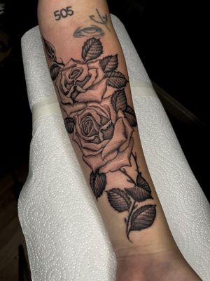 Elegant black and gray dotwork style featuring a detailed illustrative rose design by the talented artist Barney Coles.