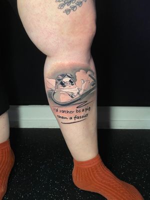 Experience the magic of Studio Ghibli with this stunning Porco Rosso anime tattoo on your lower leg. Features a meaningful quote by Marie Terry.