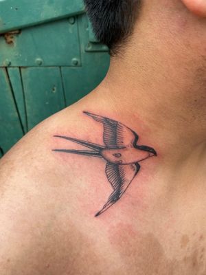 Celebrate timeless tradition with a classic swallow motif done by the talented artist, Charlie Macarthur.
