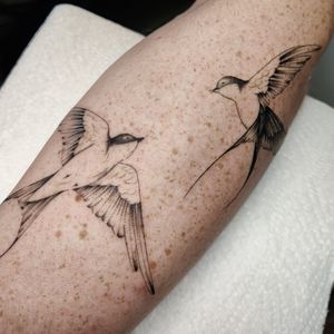 Elegant and detailed fine line swallow tattoo design by talented artist Mary Shalla.