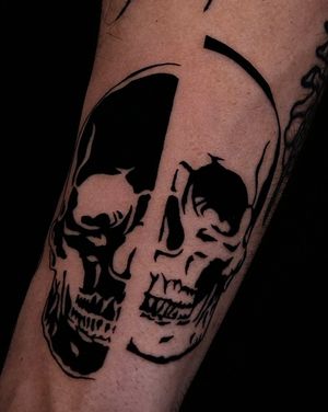 Get a striking illustrative skull tattoo from the talented artist Andrew Garinther, showcasing his bold blackwork style.