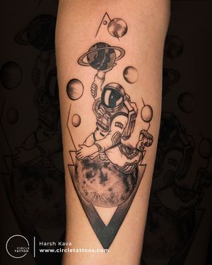 Astronaut sitting on Moon Tattoo made by Harsh Kava at Circle Tattoo India