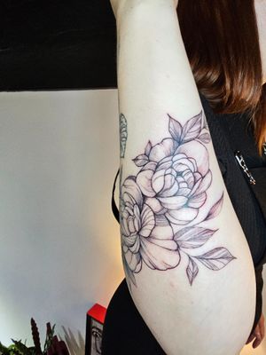 Elegant and intricate floral design with a delicate touch, expertly done by Katia Barria. Perfect for those who appreciate fine line tattoos.