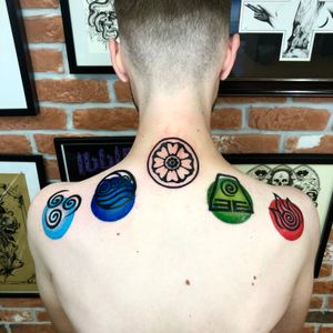 Show your love for The Last Airbender with this anime tattoo featuring elemental glyphs, created by tattoo artist Liam Collins.