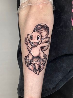 Get a unique anime-style Charmander tattoo with intricate dotwork shading, crafted by the talented artist Liam Collins.
