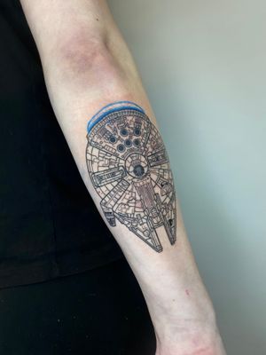 Get a sleek and detailed Star Wars tribute with this illustrative fine line tattoo of the Millennium Falcon by the talented artist Liam Collins.
