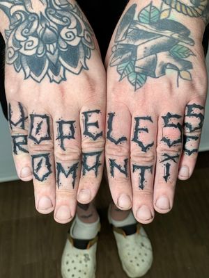 Get personalized lettering by the talented artist Liam Collins on your finger for a unique and stylish look.