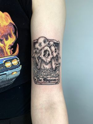 Illuminate your skin with this dotwork tarot card tattoo. Let Liam Collins bring the magic of the magician to life in intricate detail.