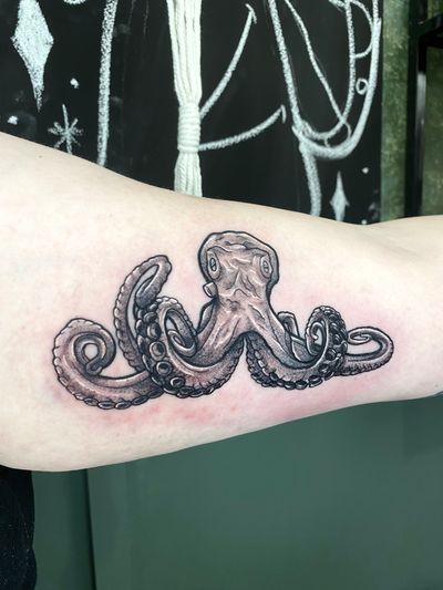 Experience the intricate details of this black and gray dotwork octopus design, expertly rendered by Liam Collins.