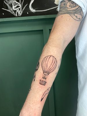 Discover the beauty of a hot air balloon rendered in fine line illustrative style by the talented artist Liam Collins.