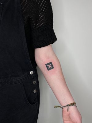 Get this sleek and stylish illustrative tattoo of the xx logo by talented artist Liam Collins. Perfect for fans of the band or those who appreciate minimalist designs.