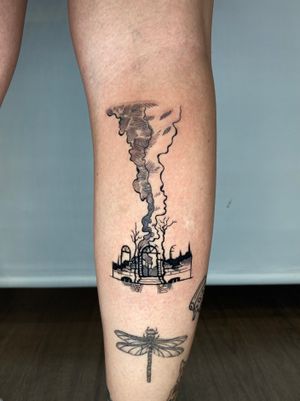 Captivating illustrative tattoo by Liam Collins featuring a burnt house motif, showcasing his unique style.