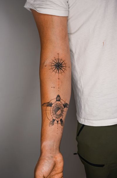 Fine line and illustrative style tattoo by Gabriele Edu featuring a turtle and compass motif on a sea card background.