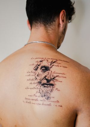 Capture the elegance of ancient Greece with this small lettering tattoo featuring a Greek statue by Gabriele Edu.
