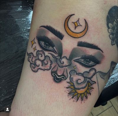 Experience the beauty of the heavens with this neo-traditional tattoo featuring clouds, sun, moon, eyes, and a mysterious woman. Expertly done by Katy Sarsfield.