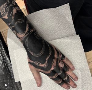 Explore the beauty of blackwork with this stunning intricate pattern tattoo on the lower arm, expertly done by Katy Sarsfield.