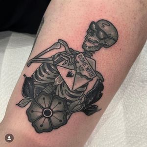 Small lettering and neo-traditional style combine in this illustrative tattoo featuring a skeletal figure reaching out to a delicate flower. Come with me on this journey of life and death. 
