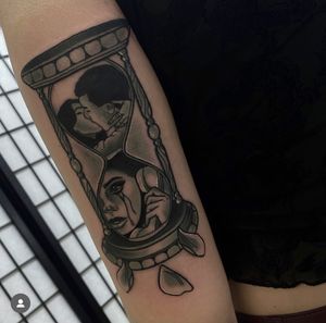 An illustrative tattoo by Katy Sarsfield featuring an hourglass, movie reel, and vintage phone. Perfect for film enthusiasts and nostalgic souls.