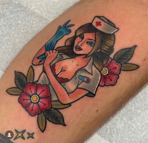 Get inked with a stunning neo-traditional tattoo of a lady nurse by talented artist Katy Sarsfield on your arm.