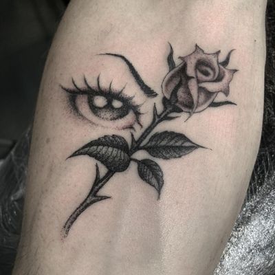 Unique blackwork and dotwork blend depicting a stunning rose and mysterious eye, expertly done by Gianluca Fusco.