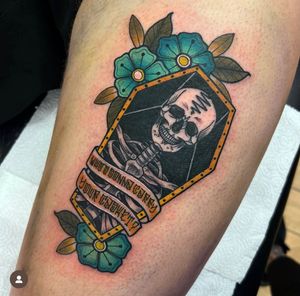 Get a stunning neo-traditional tattoo of a skull and coffin on your thigh by the talented artist Katy Sarsfield.