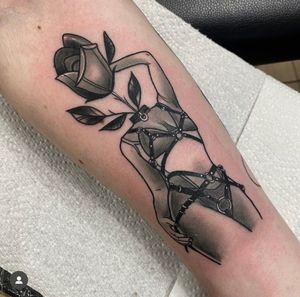 Stunning neo-traditional tattoo by Katy Sarsfield featuring a beautiful rose entwined with a seductive woman in a BDSM theme.