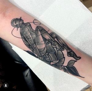 Arm tattoo by Katy Sarsfield inspired by Hajime Sorayama, featuring a seductive floating robot woman in a neo-traditional style.