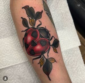 Adorn your lower arm with Katy Sarsfield's lively neo-traditional ladybug design. Symbolizing good luck and protection, this tattoo is sure to make a statement.