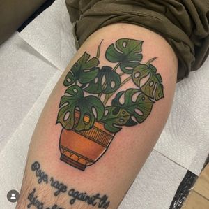 Exquisite neo-traditional tattoo by Katy Sarsfield featuring a beautiful vase with monstera plant design.