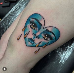 Get a stunning neo traditional tattoo featuring a heart and face design, expertly executed by talented artist Katy Sarsfield.