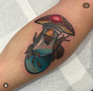 Admire Katy Sarsfield's intricate neo-traditional mushroom design on your lower arm, a unique and stunning piece of art.