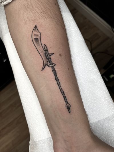 Experience the intricate dotwork and illustrative style of Barney Coles with this traditional halberd tattoo design.