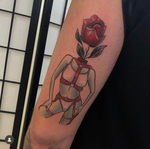 Illustrative tattoo by Katy Sarsfield featuring a provocative fusion of rose, woman, and BDSM elements.