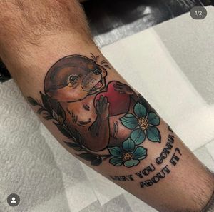 Express your attitude with this bold lettering and whimsical otter design. Unique and eye-catching, this tattoo will definitely make a statement.