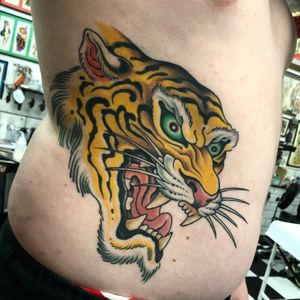 Capture the power and strength of a traditional tiger tattoo by renowned artist Gianluca Fusco.