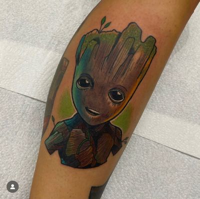 Show your love for Guardians of the Galaxy with this neo-traditional tattoo of Groot, beautifully executed by artist Katy Sarsfield.