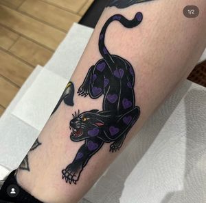 Get fierce with this stunning panther tattoo by the talented Katy Sarsfield. Perfect for those who love neo-traditional style.