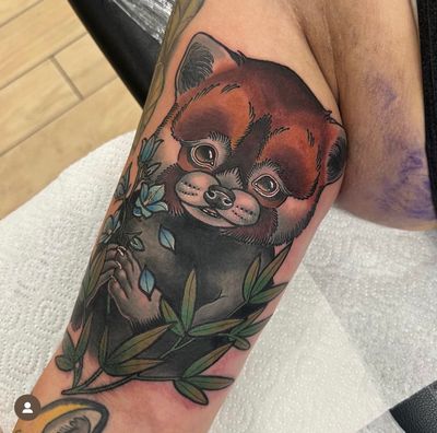 Capture the strength and courage of a bear with this striking neo traditional arm tattoo by renowned artist Katy Sarsfield.
