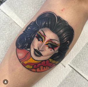 Get revved up with this colorful and dynamic neo-traditional tattoo by Katy Sarsfield. Celebrate the thrill of the drag race in style!