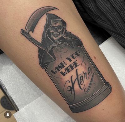 Beautiful tattoo featuring a reaper and grave with the message 'Wish You Were Here' by artist Katy Sarsfield.
