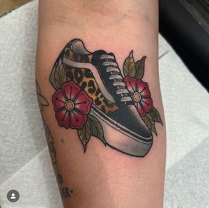 Check out this colorful and detailed forearm tattoo of Vans shoes, done in a neo-traditional style by the talented artist Katy Sarsfield.