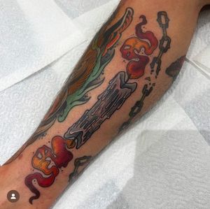 Adorn your lower leg with a neo-traditional candle tattoo by the talented Katy Sarsfield. Embrace the flickering flame and timeless style.