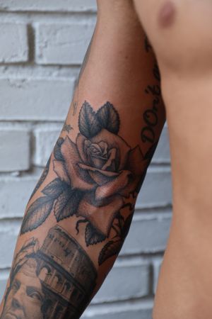 Get inked with a stunning traditional rose tattoo by the talented artist Jeppe Dahl Rørdam on your arm. Classic and timeless design that will make a statement.