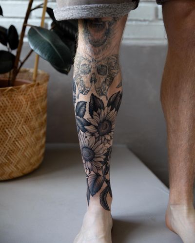 Unique dotwork style sunflower tattoo with intricate floral details, masterfully executed by Jeppe Dahl Rørdam.
