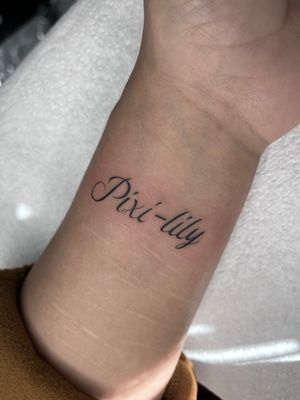 Simple and elegant small lettering tattoo on the wrist by talented artist Claudia Whiteheart.