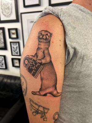Elegant dotwork style illustration of a ferret, expertly executed by tattoo artist Jack Howard.