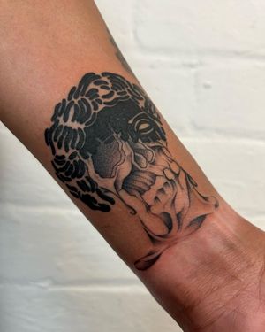 Experience the dark beauty of blackwork and dotwork with this mesmerizing skull design by Jack Howard.